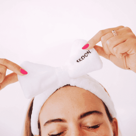 Image of a lady wearing the SKOON. Bunnie Headband